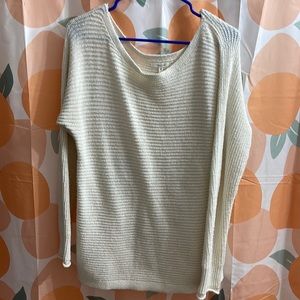 Cream/white oversized sweater. Not super thick.